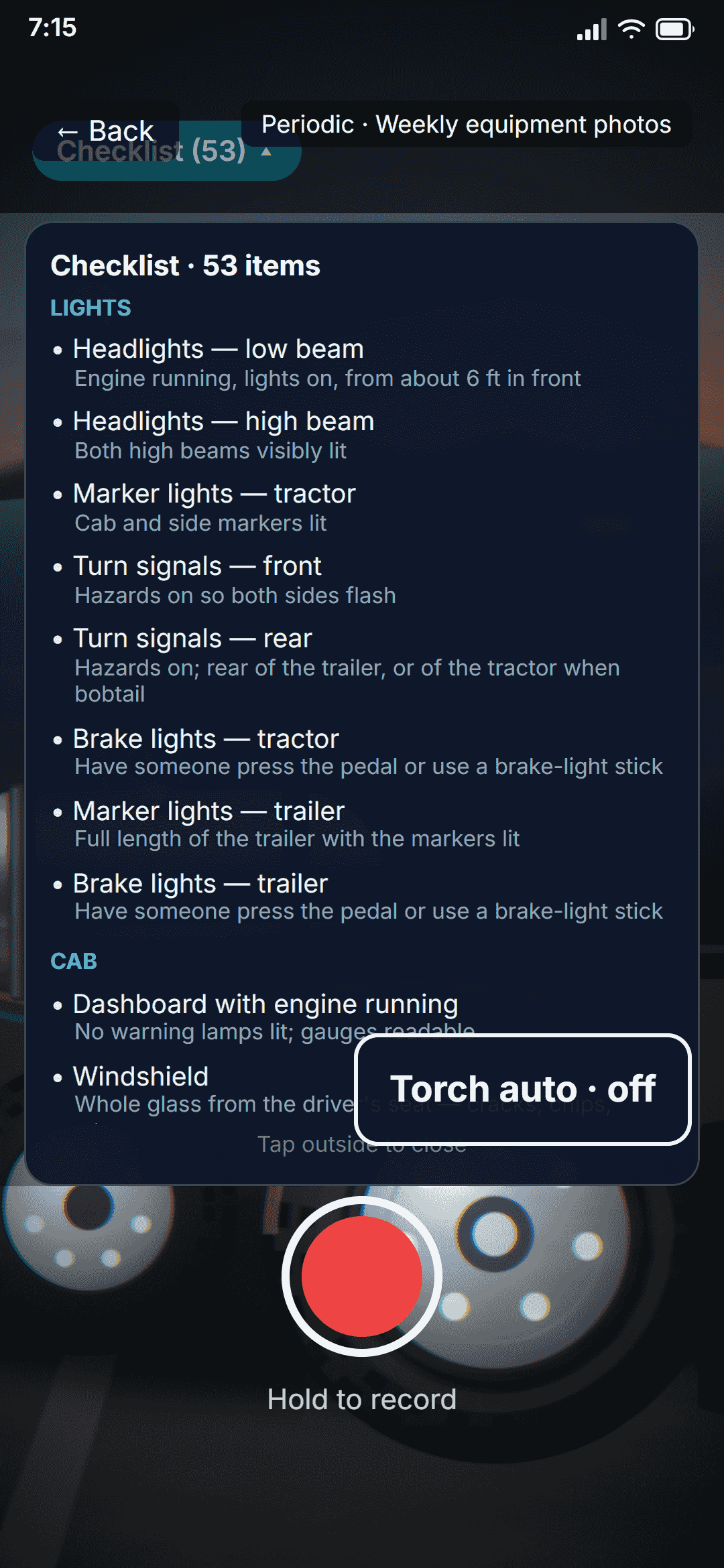 A periodic company checklist open in the camera: the fleet's own weekly template, 53 items grouped by lights, cab and tractor, each with the instruction the office wrote for it.