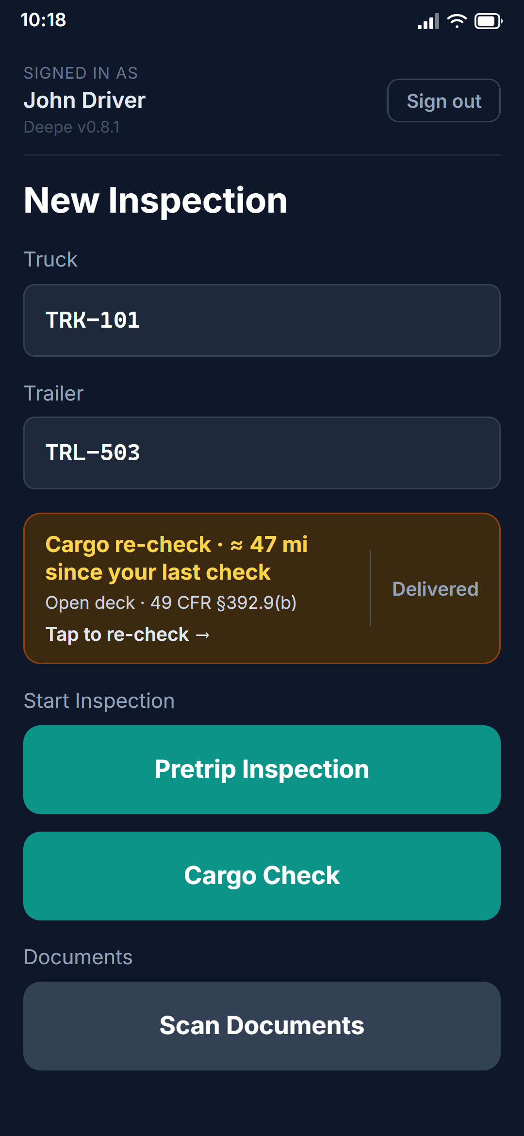 The driver's home screen carrying an en-route re-check: about 47 miles since the last look at the load, cited to 49 CFR §392.9(b), with one tap to re-check and one to say the load was delivered.