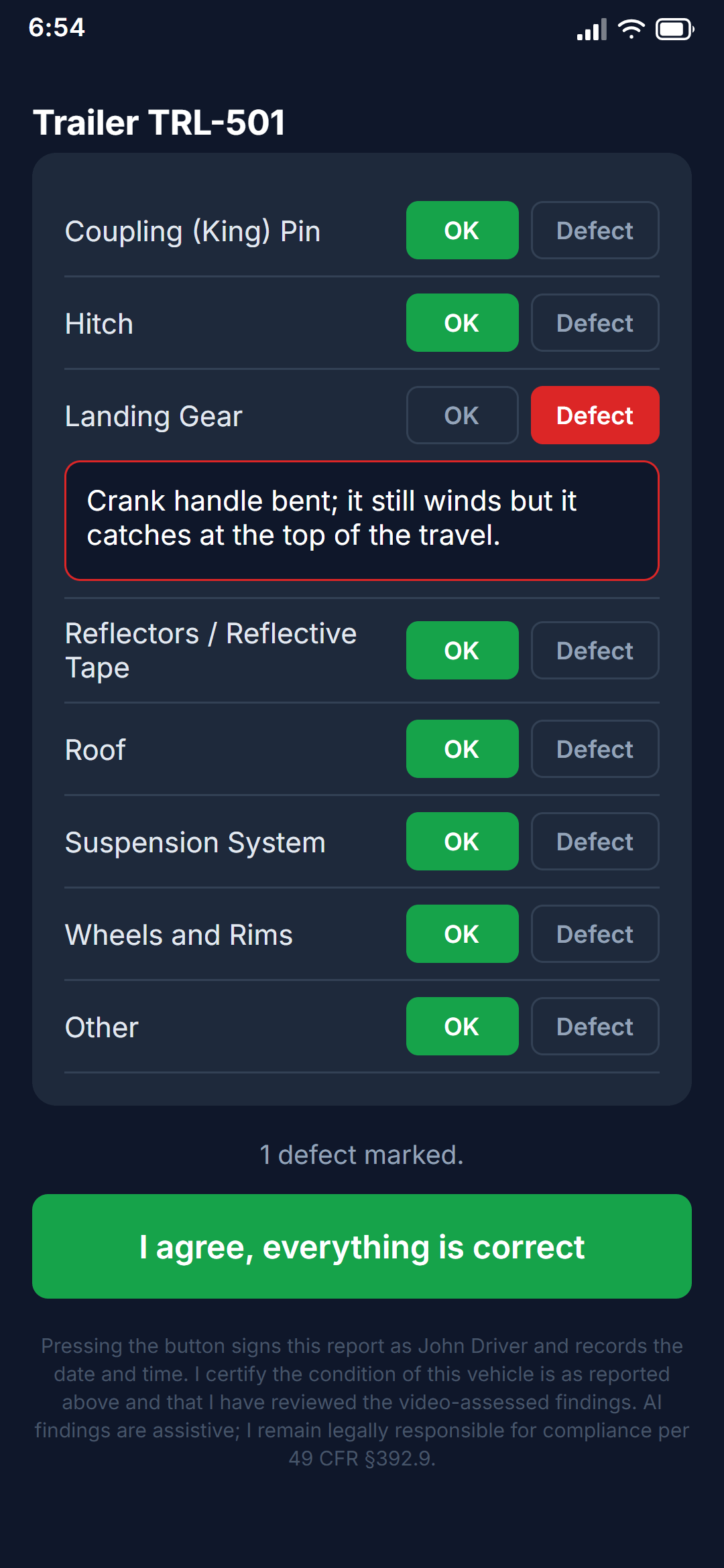 The end of the sign-off: the trailer items the driver checks by hand, one marked as a defect with the remark the app requires for it, the defect count, and the button that signs the report in the driver's name.